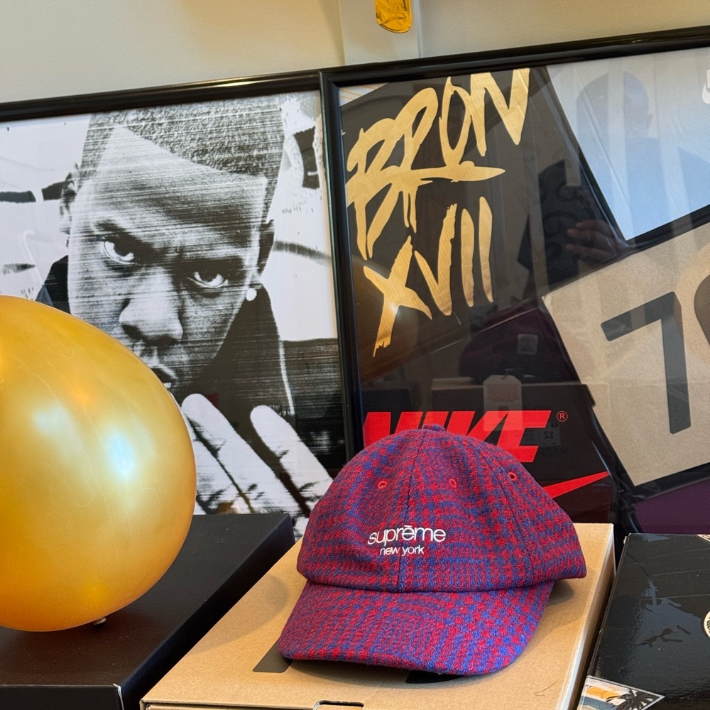Hand woven tweed SUPREME cap with leather strap